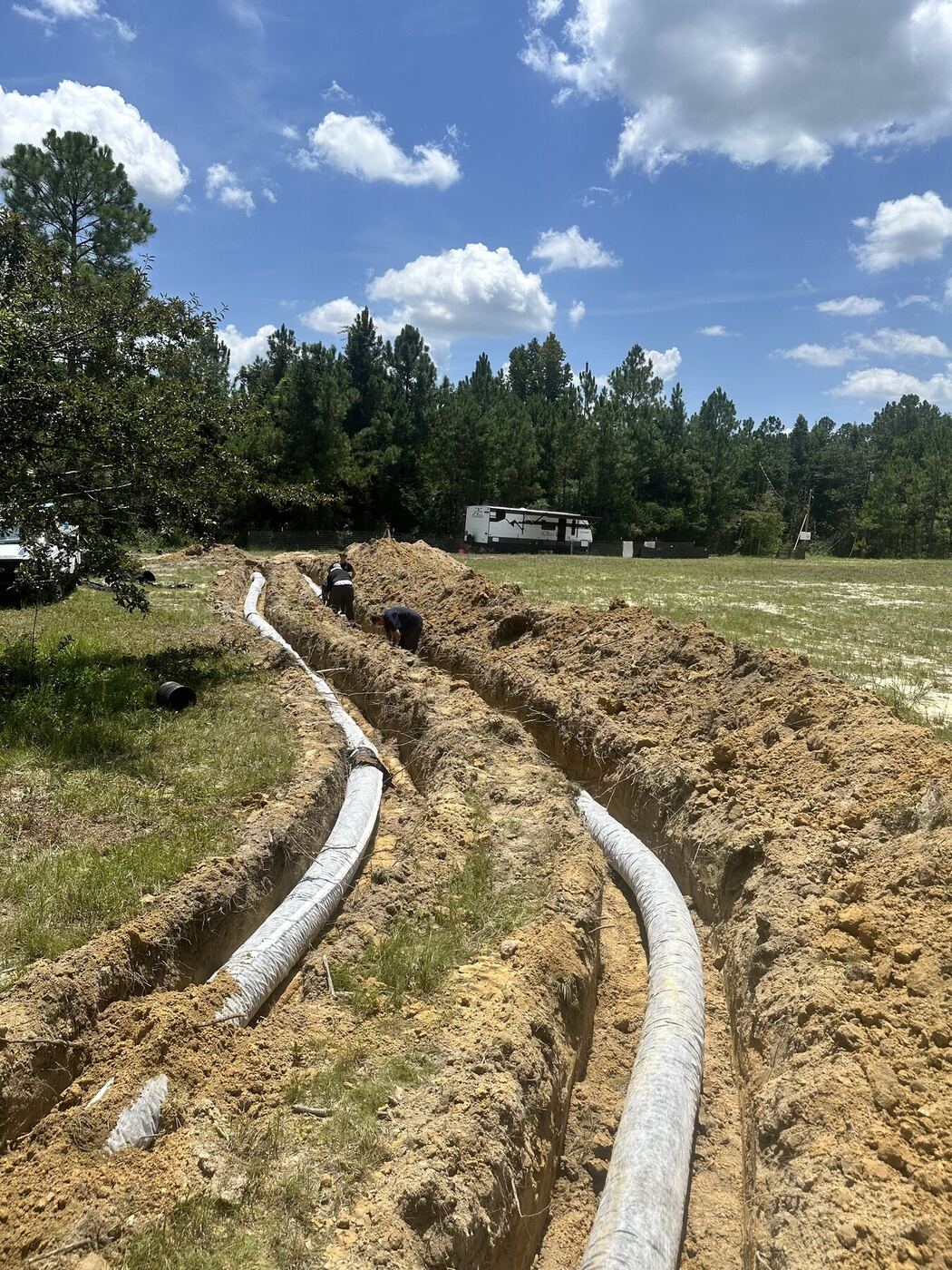 Quick Rooter crew installing septic field lines